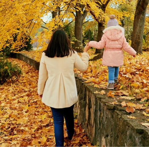 Woman holding a child’s hand | Singlife SG