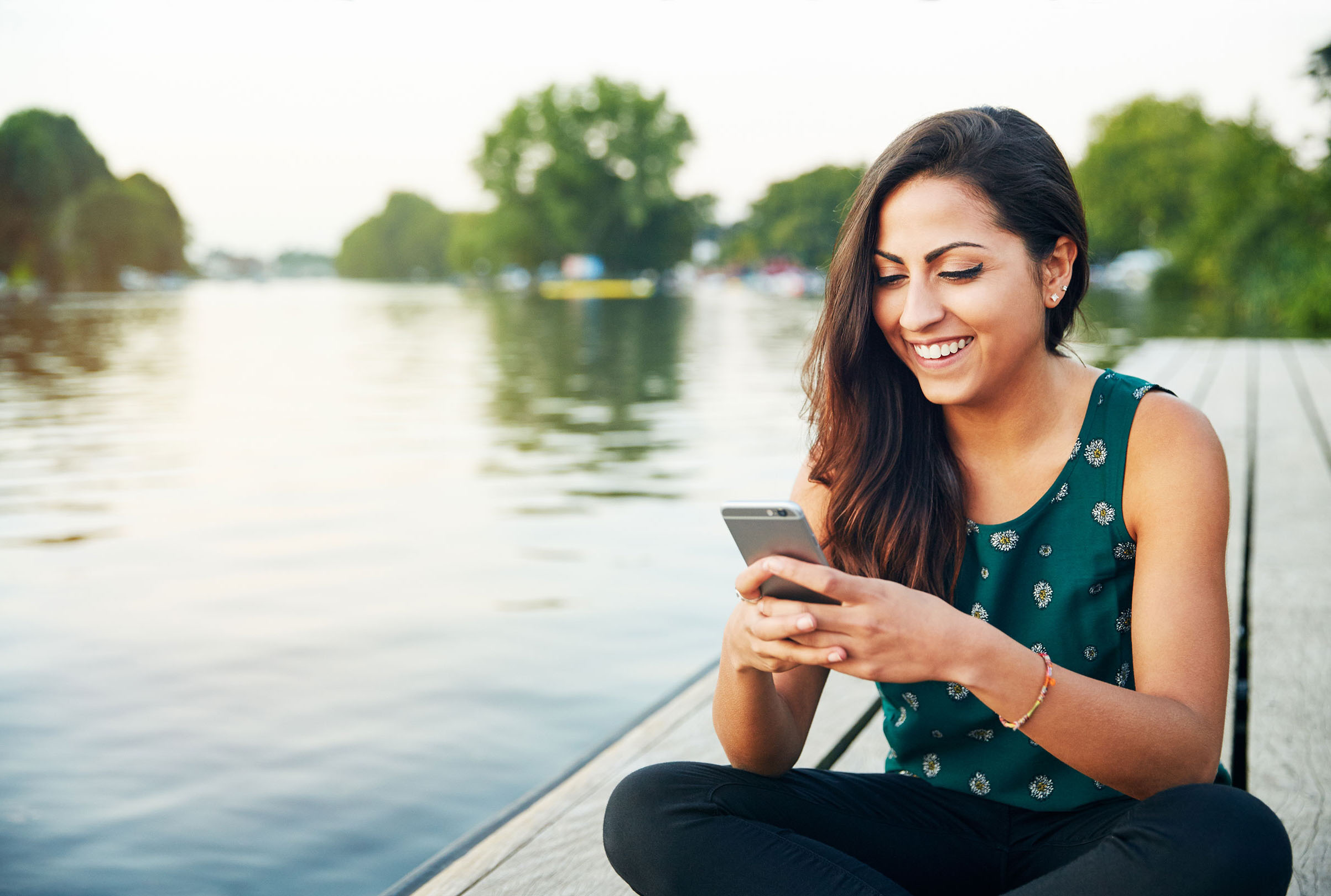 image of a woman using her phone