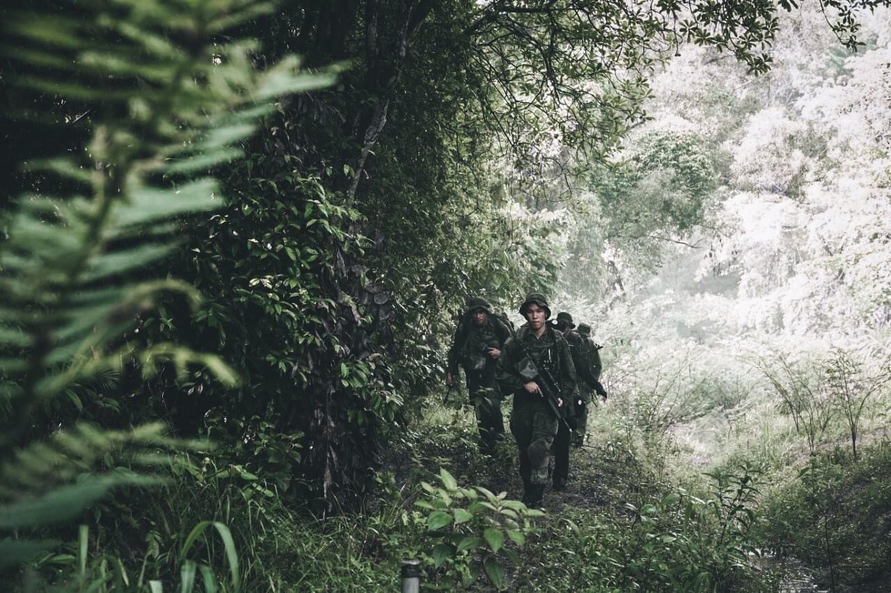 NS men trekking through jungle